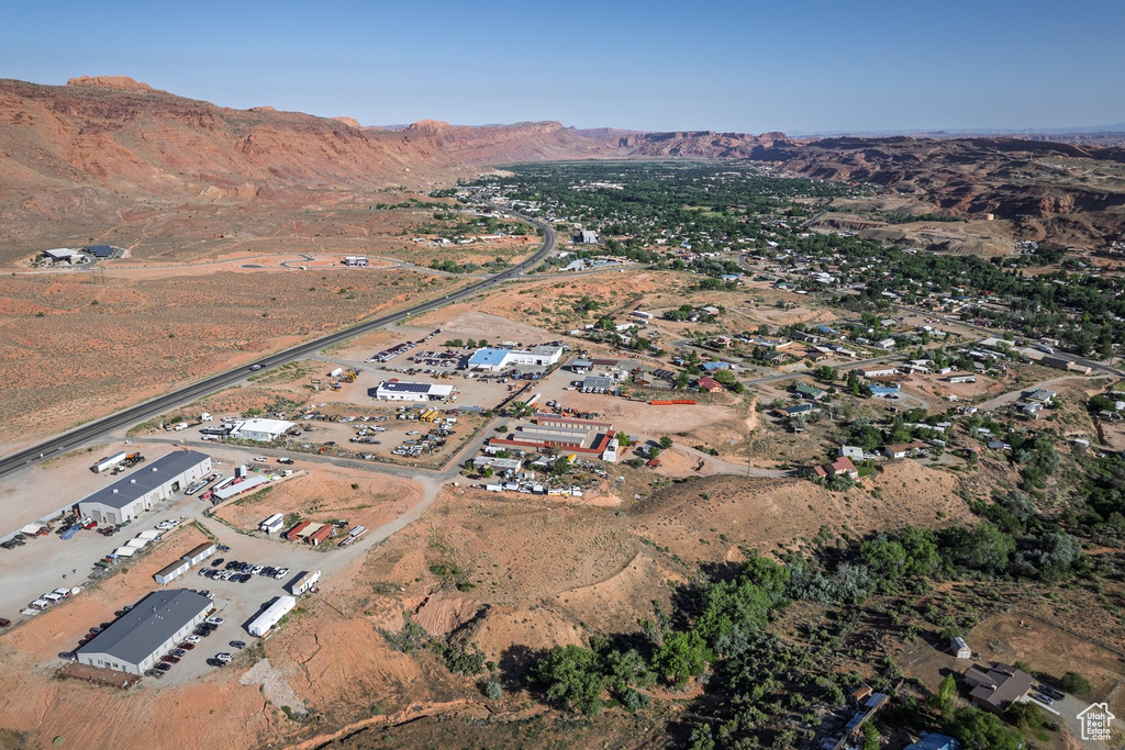 Aerial view of property's location with a mountain backdrop