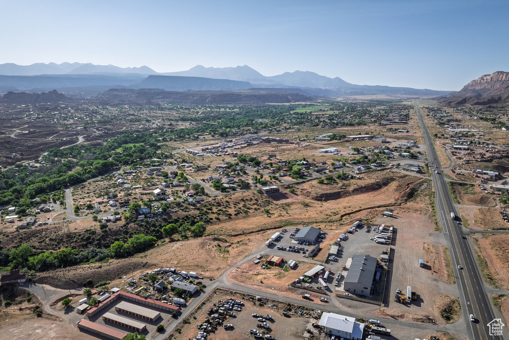 Aerial view of property's location with a mountain backdrop