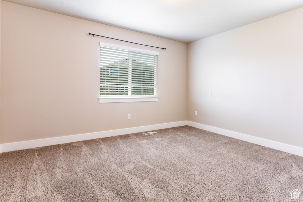 Empty room featuring carpet