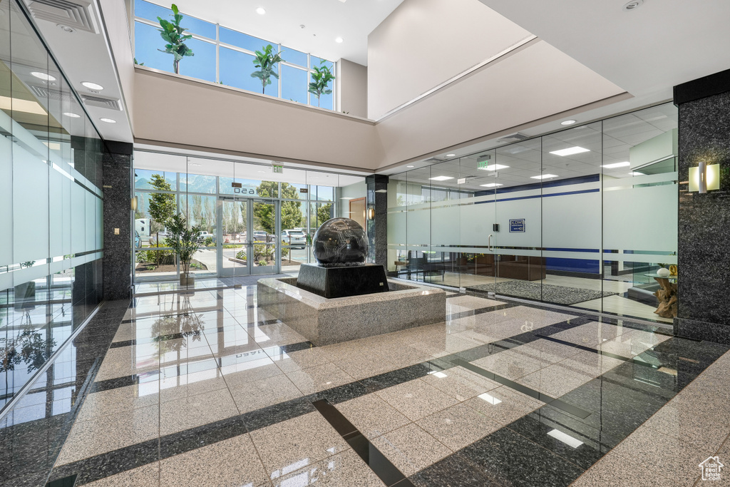 Lobby featuring a high ceiling and recessed lighting