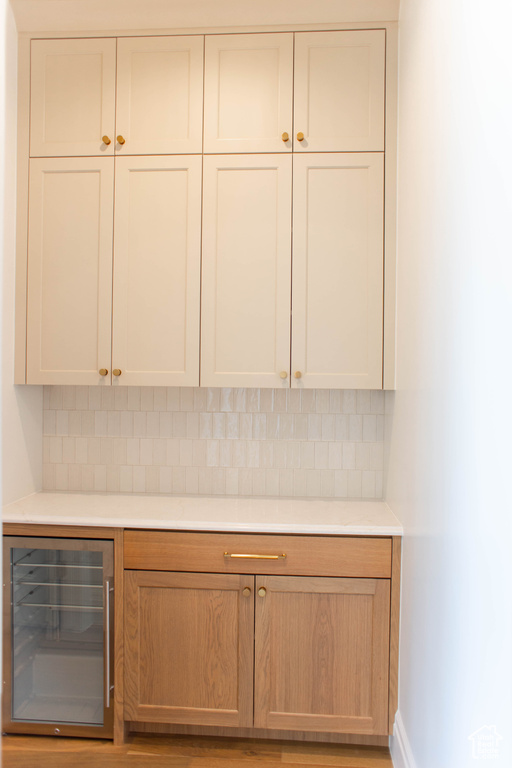 Bar with beverage cooler and backsplash