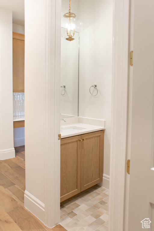 Bathroom with vanity and wood finished floors