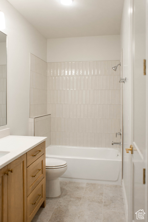 Bathroom with vanity,  shower combination, and tile patterned floors