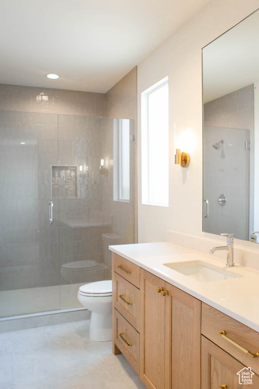 Full bath featuring vanity, a shower stall, and recessed lighting