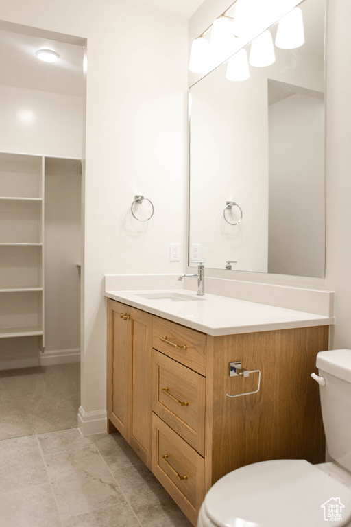 Bathroom with toilet and vanity