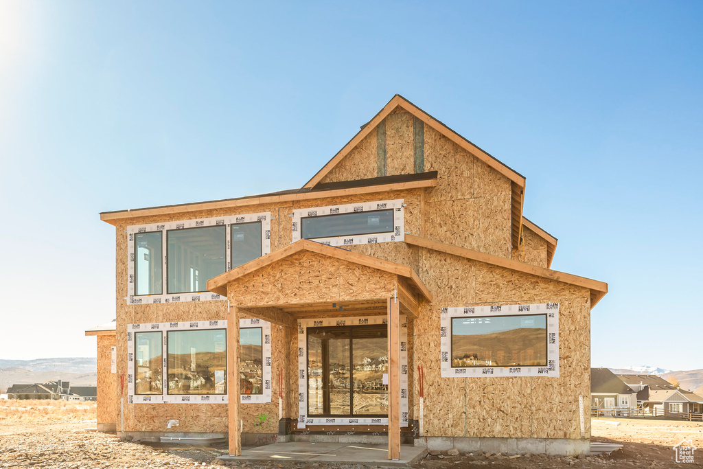 Rear view of house featuring crawl space