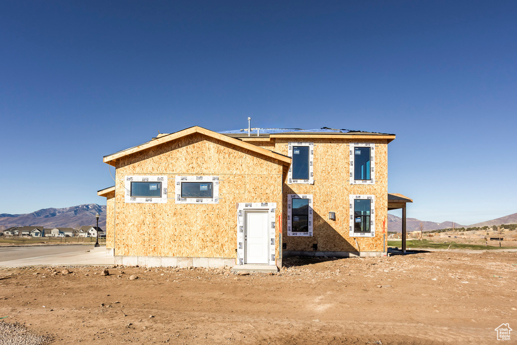 Back of house featuring a mountain view