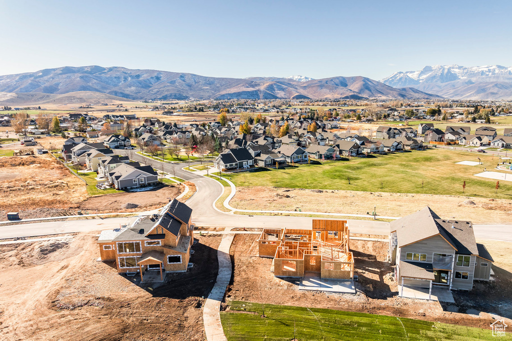 Aerial perspective of suburban area featuring a mountainous background