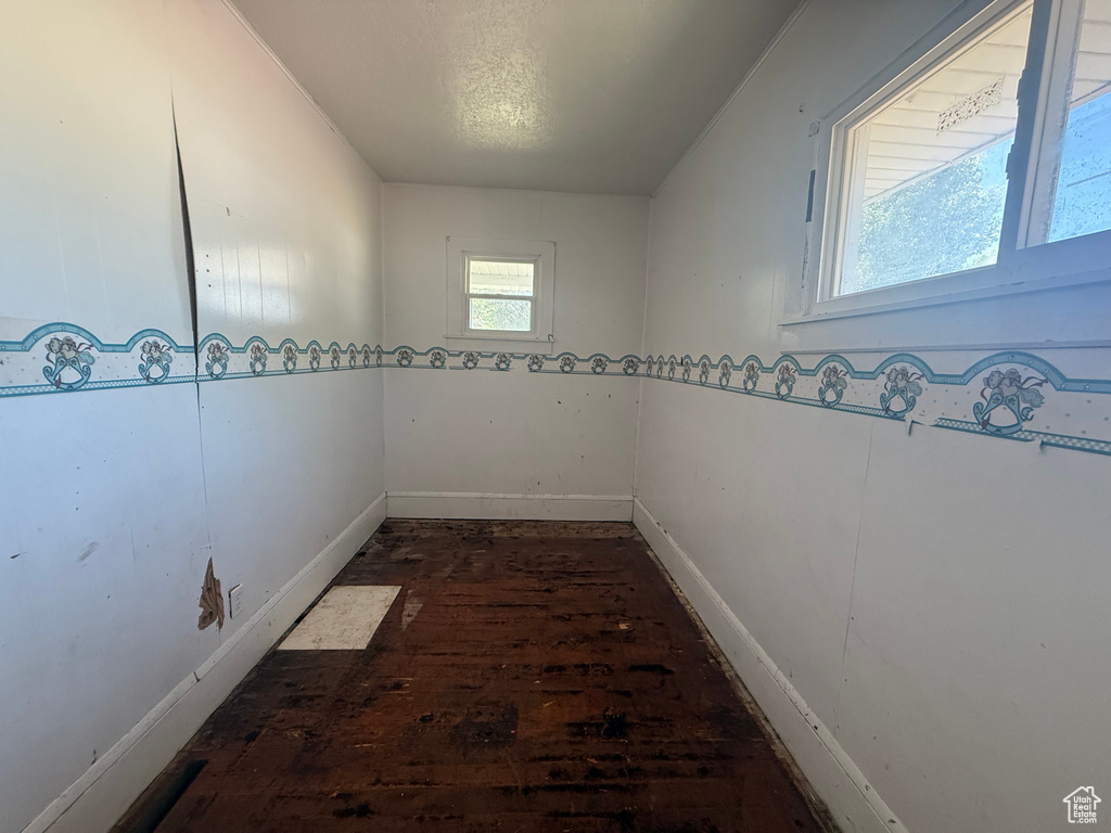 Unfurnished room featuring wood-type flooring and baseboards