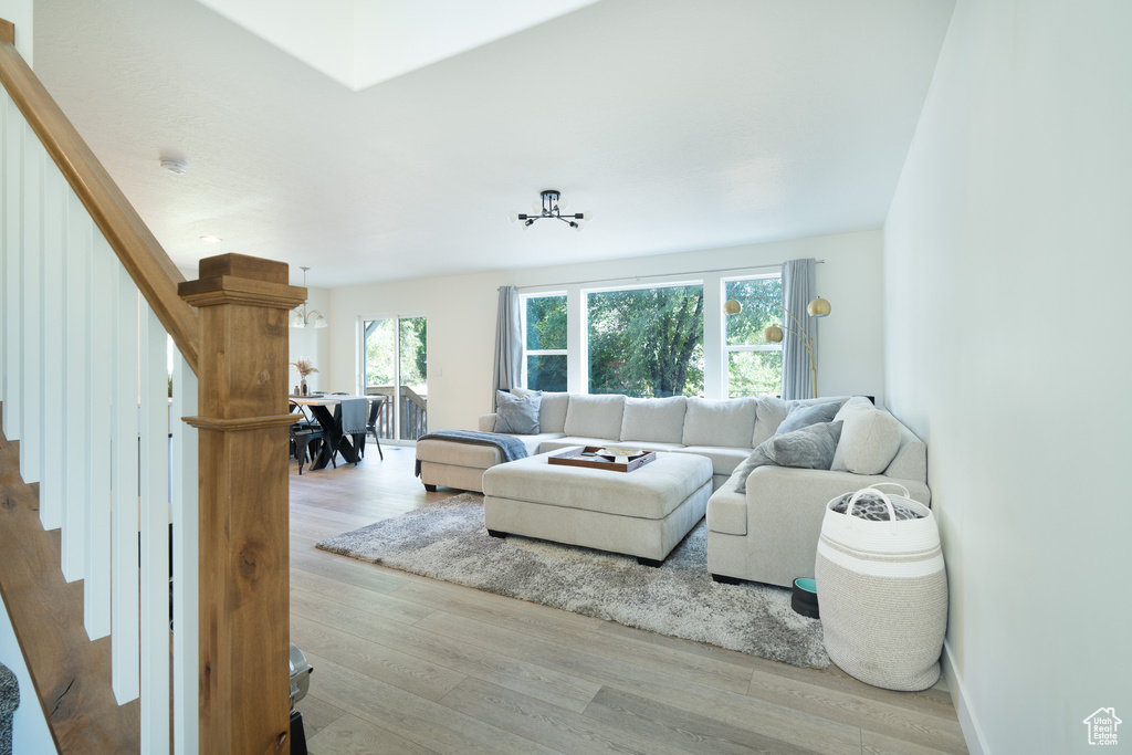 Living area featuring stairway and wood finished floors