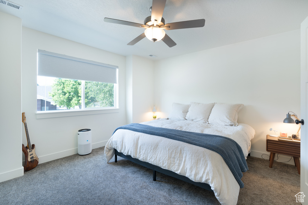 Bedroom featuring carpet flooring and ceiling fan