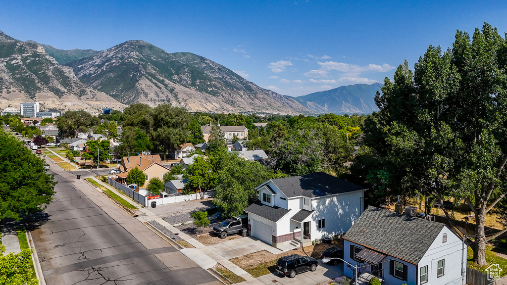 Aerial perspective of suburban area with a mountain backdrop