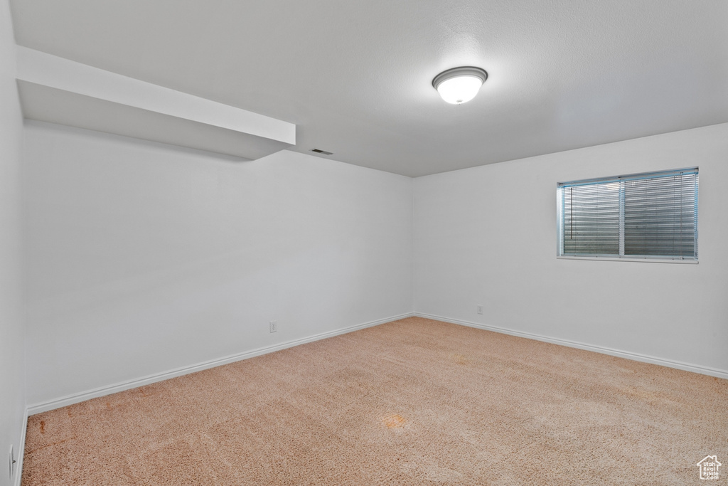 Spare room featuring carpet flooring