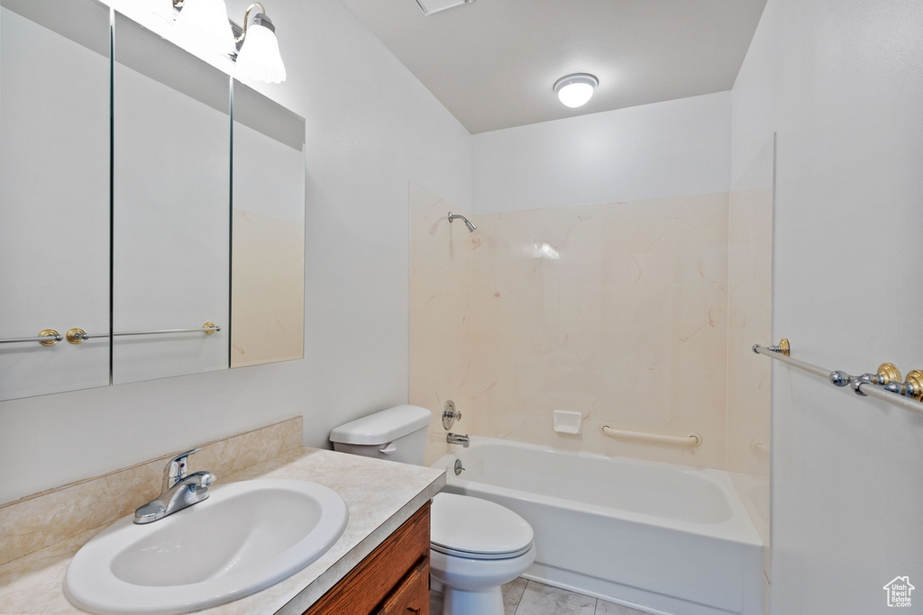 Bathroom featuring vanity and shower / washtub combination