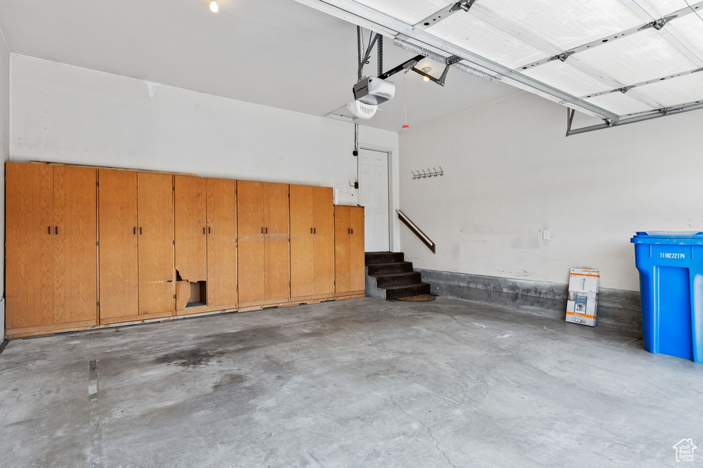 Garage featuring a garage door opener