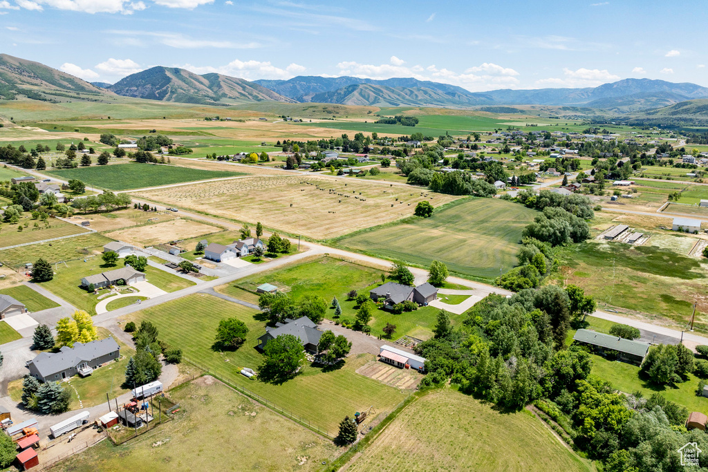 Overview of rural landscape featuring a mountainous background