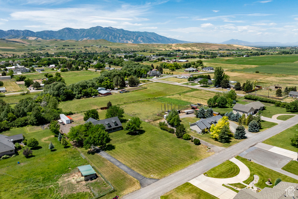 Overview of rural landscape featuring a mountainous background