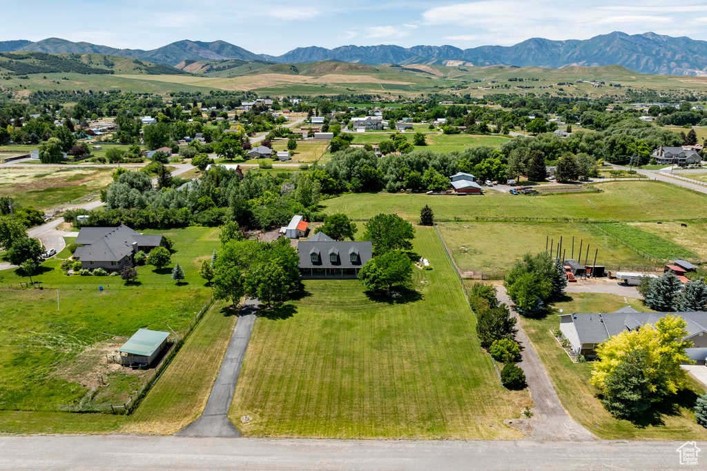 Overview of rural landscape featuring a mountain backdrop