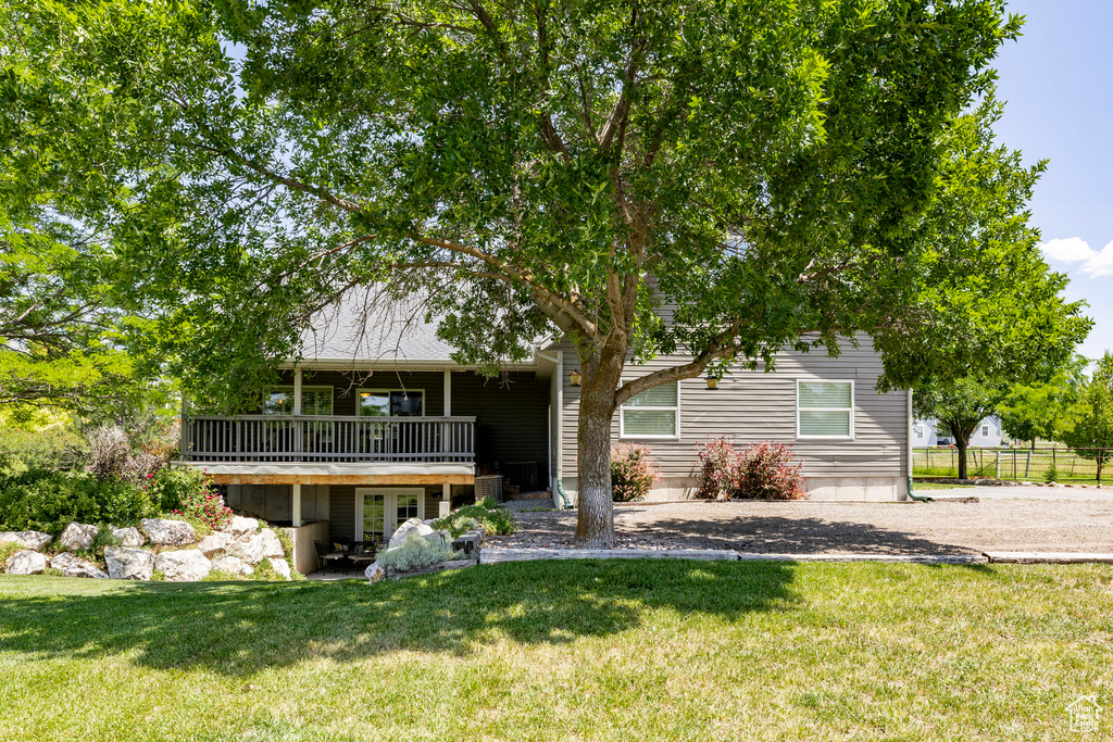 Rear view of property with a wooden deck