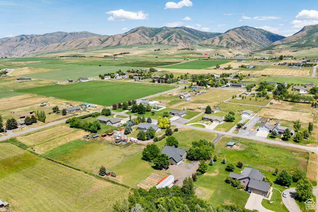 Aerial view of property\'s location with rural landscape and a mountainous background