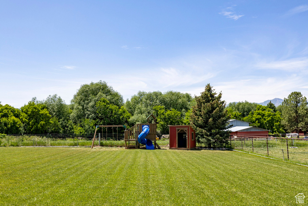 View of yard featuring a playground and a mountain view