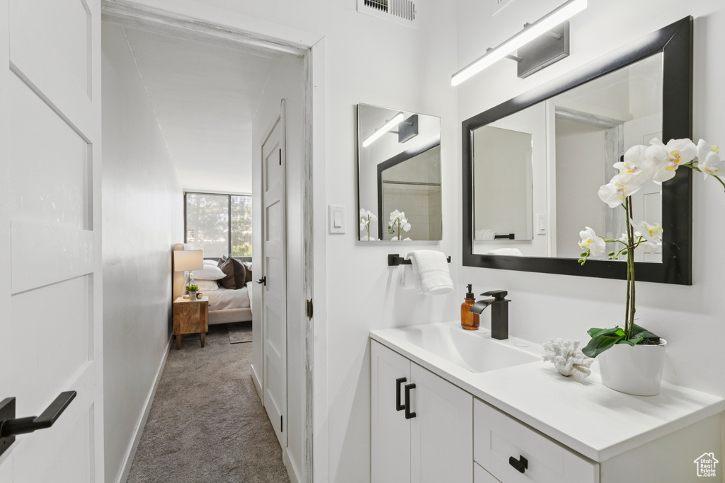 Bathroom featuring vanity and ensuite bathroom