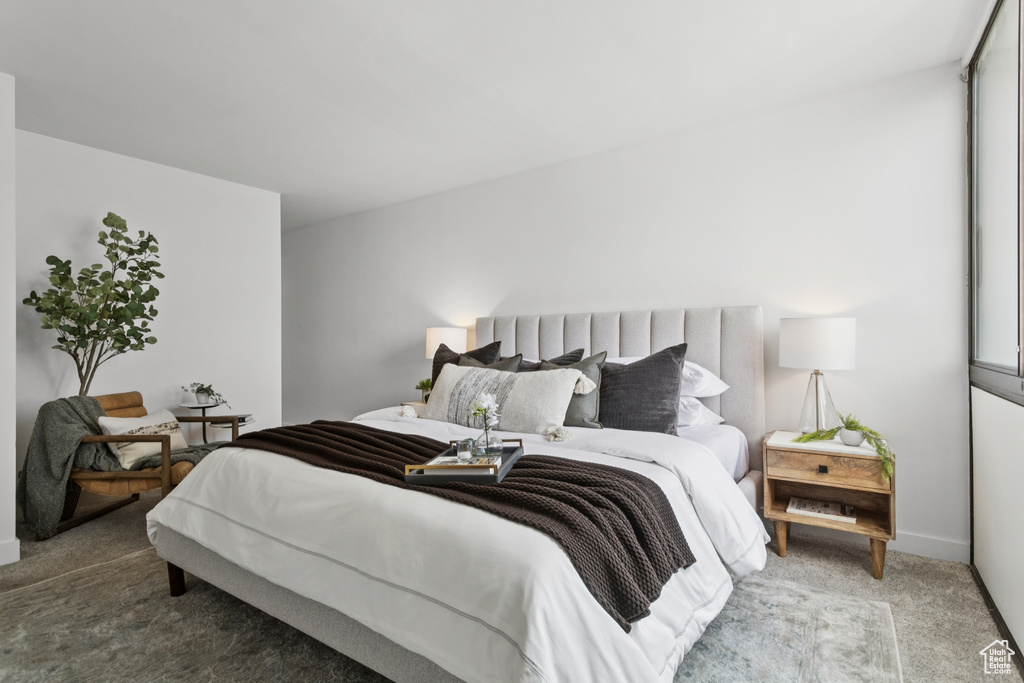 Carpeted bedroom with baseboards