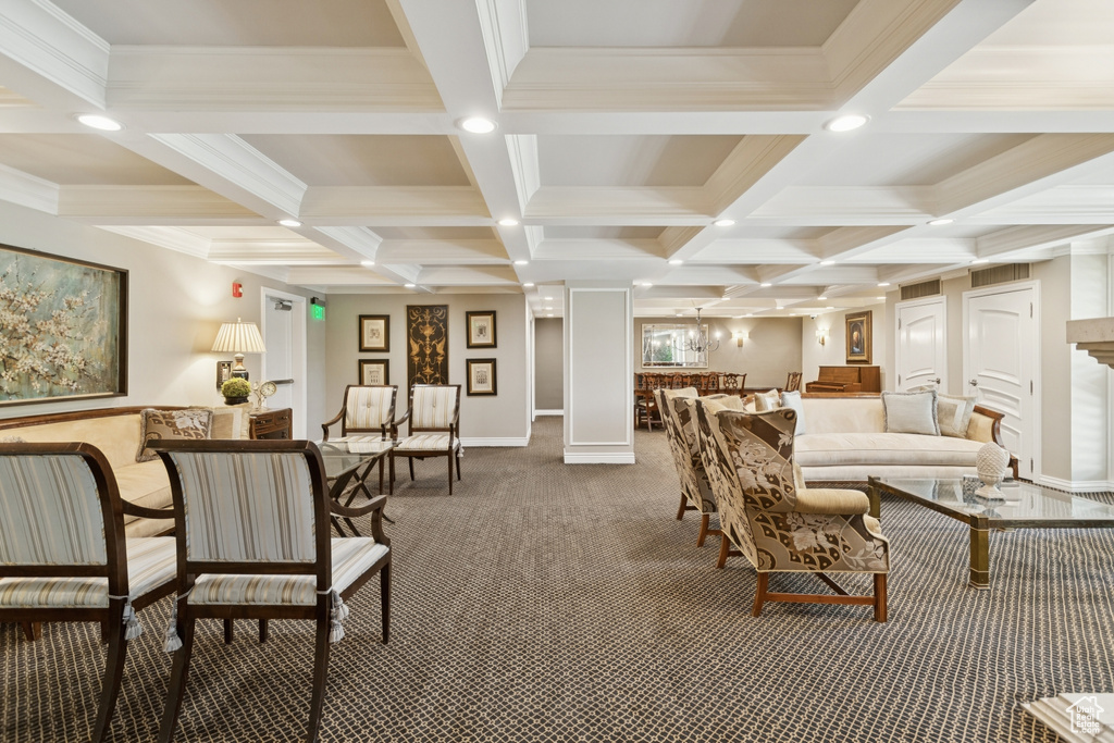 Living area featuring carpet flooring, coffered ceiling, beamed ceiling, and crown molding