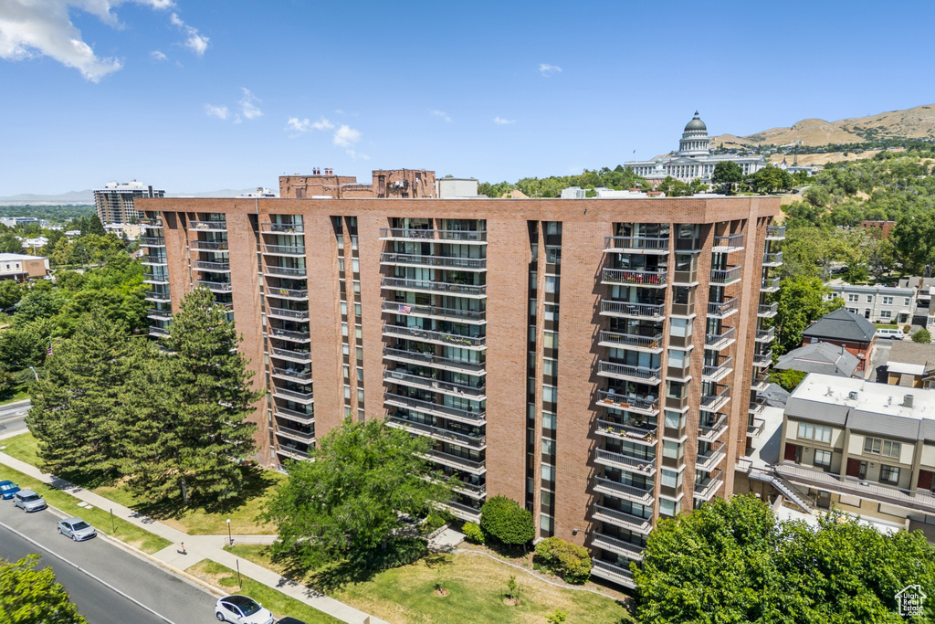 View of apartment building / complex featuring a mountain view