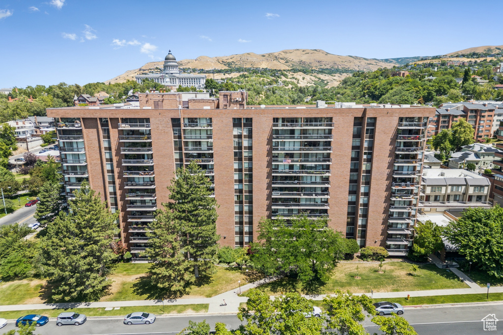 View of apartment building / complex featuring a mountain view