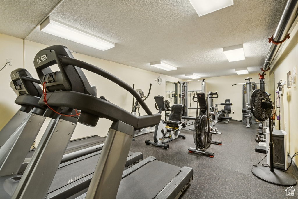 Exercise room with a textured ceiling