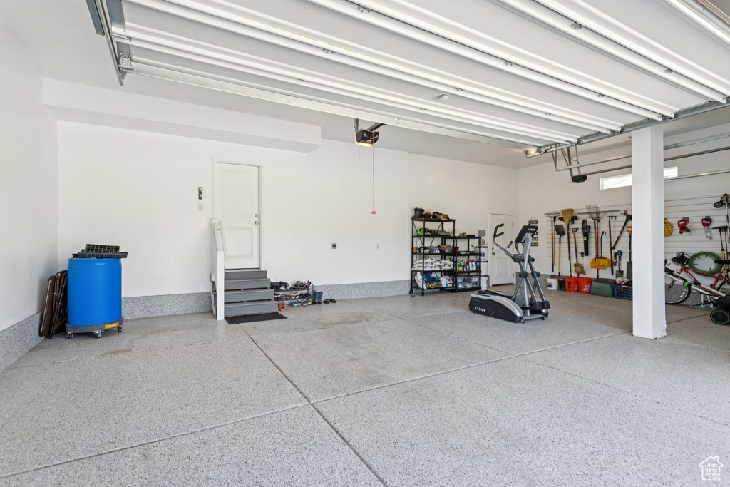 Garage featuring a garage door opener