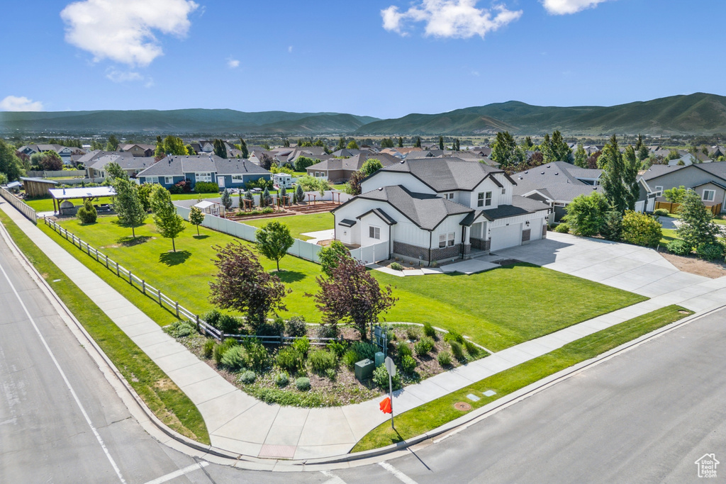 Aerial perspective of suburban area featuring a mountainous background