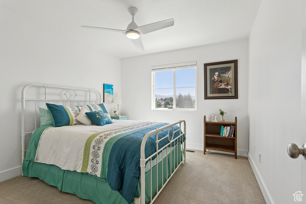 Bedroom with carpet floors and ceiling fan
