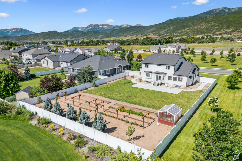 Aerial view of residential area with a mountain backdrop