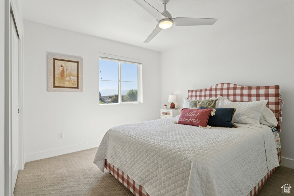 Bedroom featuring carpet flooring and ceiling fan
