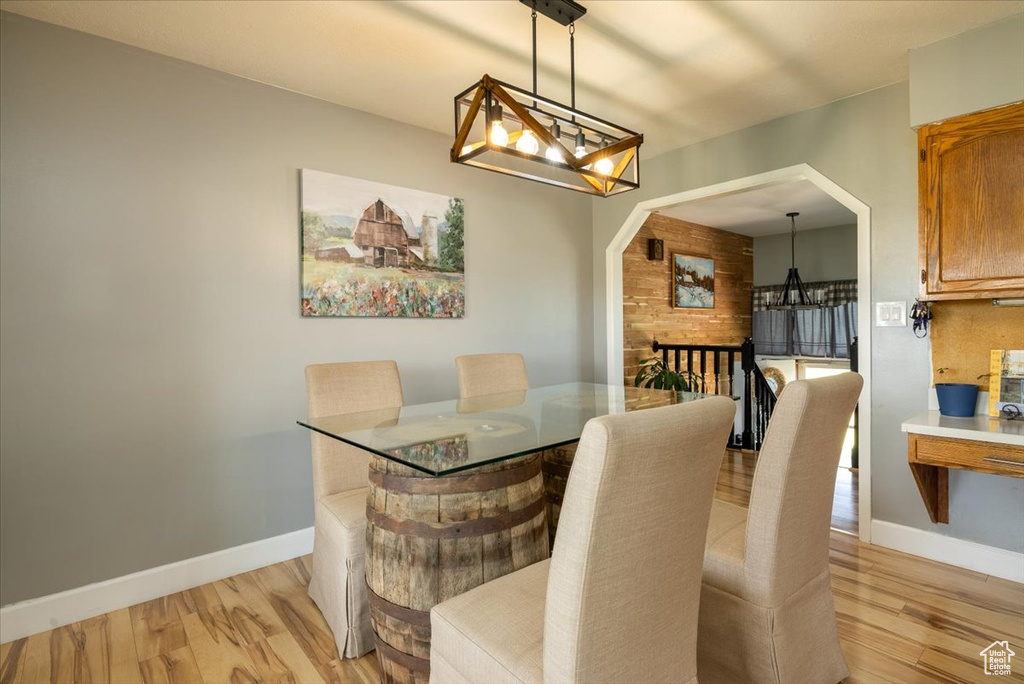 Dining room featuring a chandelier and light wood-type flooring
