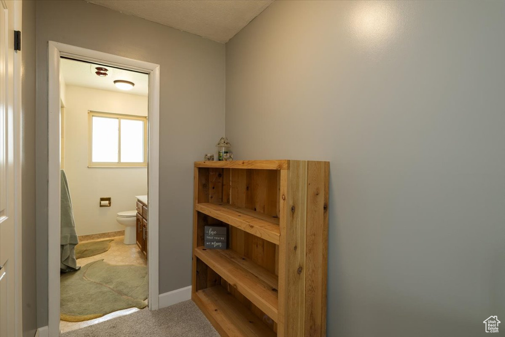 Bathroom featuring toilet and baseboards