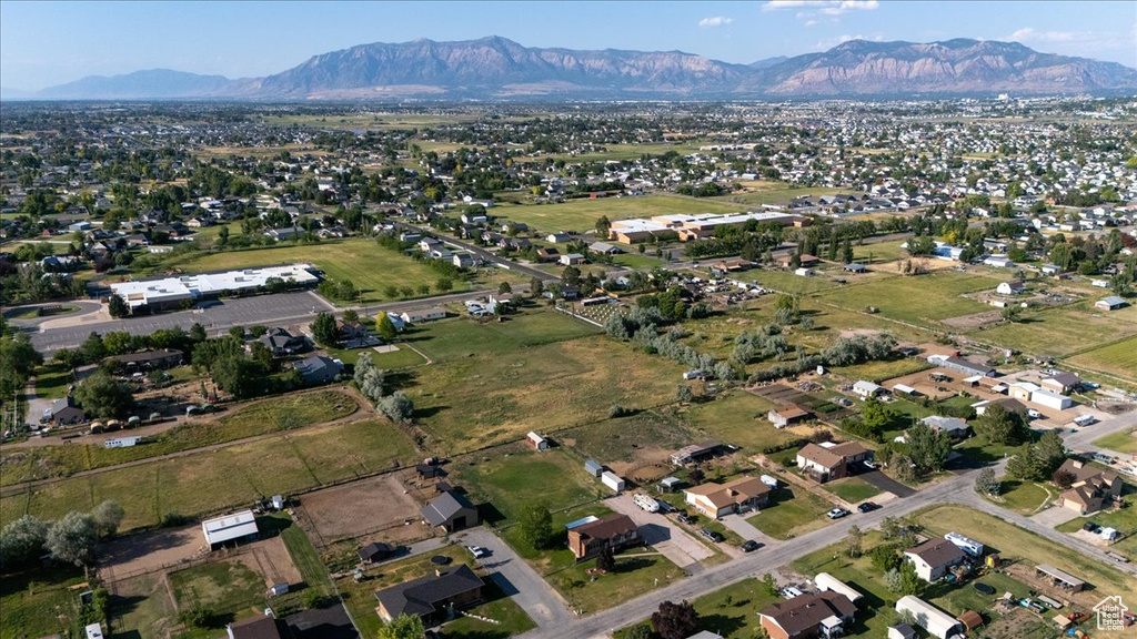 Aerial view of property\'s location featuring a mountain backdrop