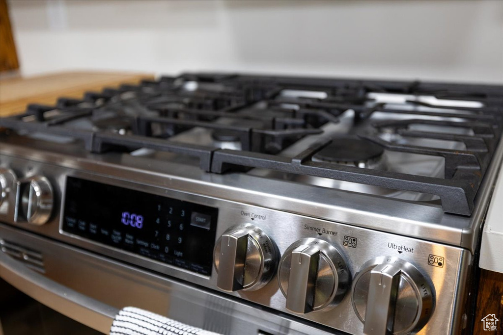 Kitchen view of stainless steel range with gas stovetop