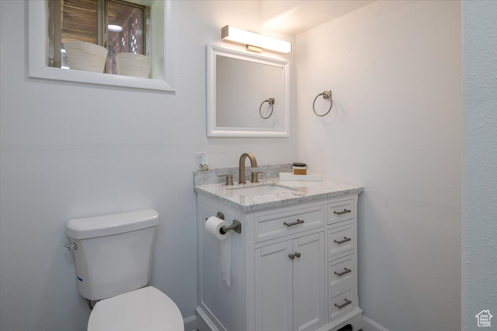 Half bath with toilet and vanity