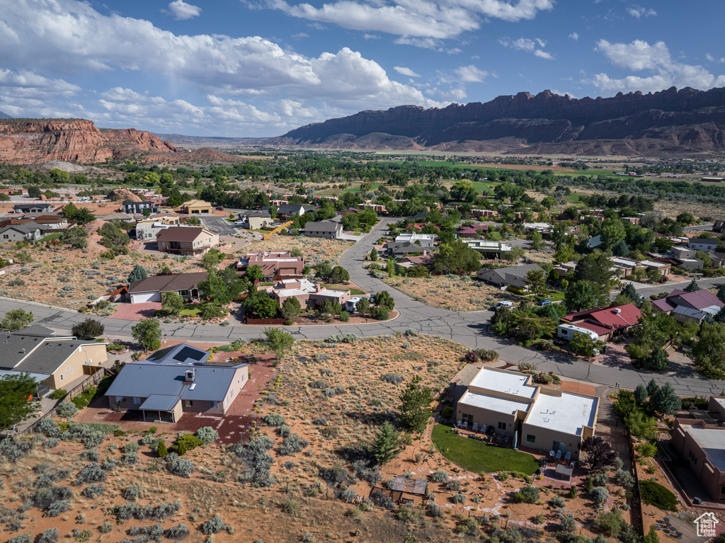 Aerial view of residential area featuring a mountainous background