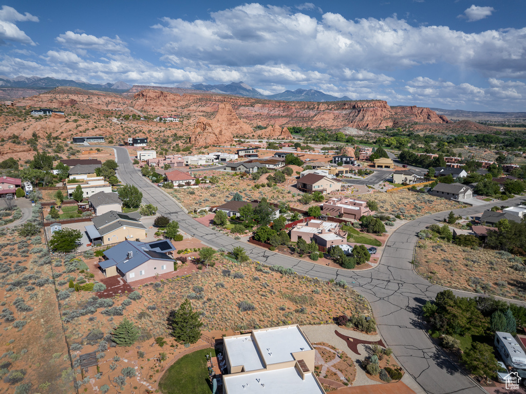 Aerial view of residential area featuring a mountain backdrop