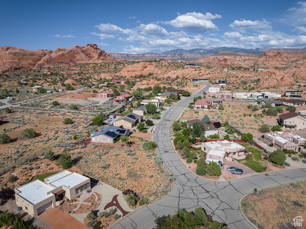 Aerial view of property\'s location with mountains and nearby suburban area