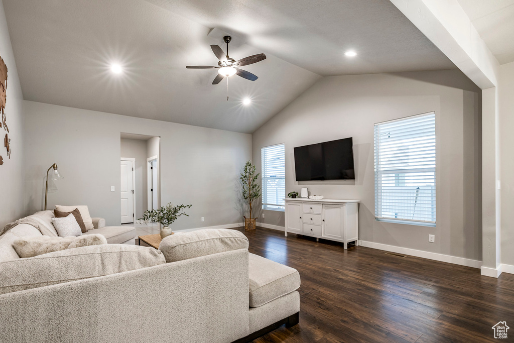 Living area featuring ceiling fan, dark wood-style flooring, recessed lighting, and high vaulted ceiling