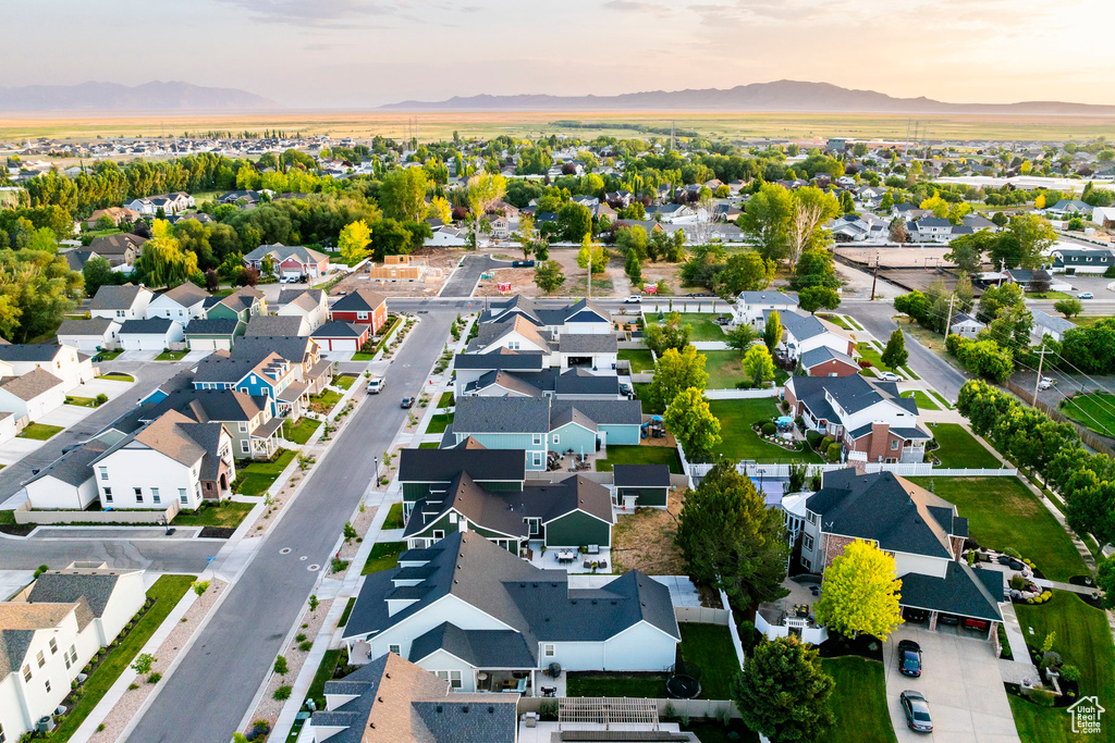 Aerial perspective of suburban area featuring a mountain backdrop