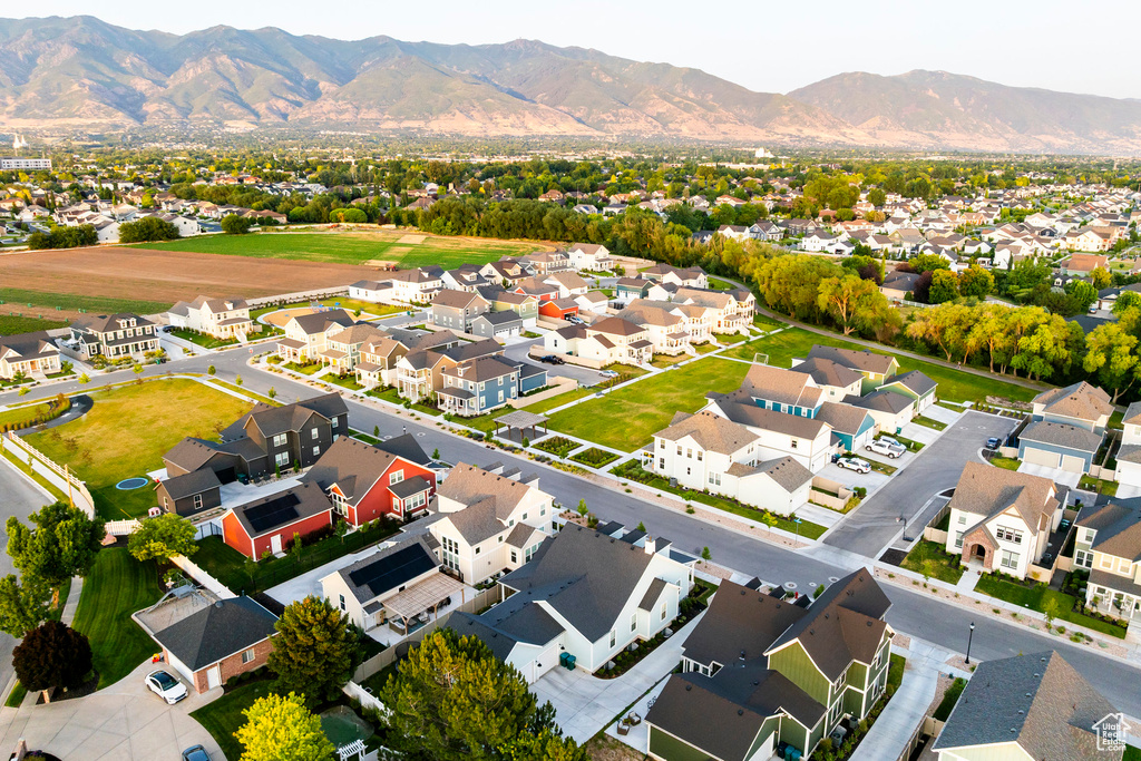 Aerial perspective of suburban area featuring a mountain backdrop