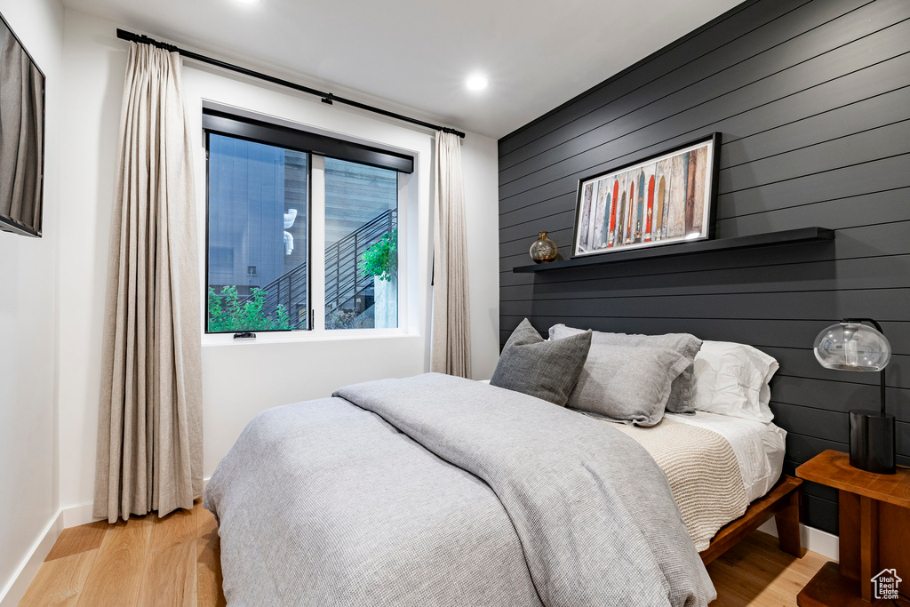 Bedroom with light wood-type flooring and recessed lighting