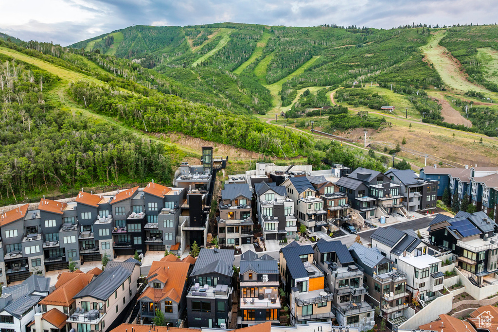 Aerial view of residential area featuring mountains