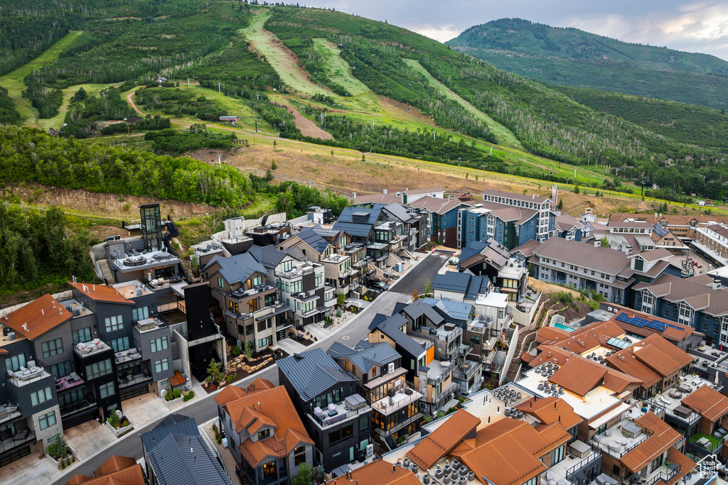 Aerial view of residential area featuring a mountainous background